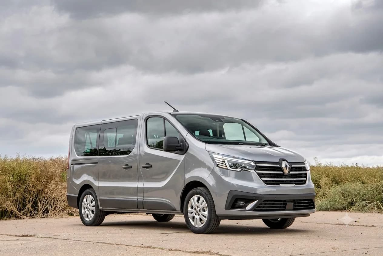 Brand-new silver Renault Trafic passenger van — front three-quarter view