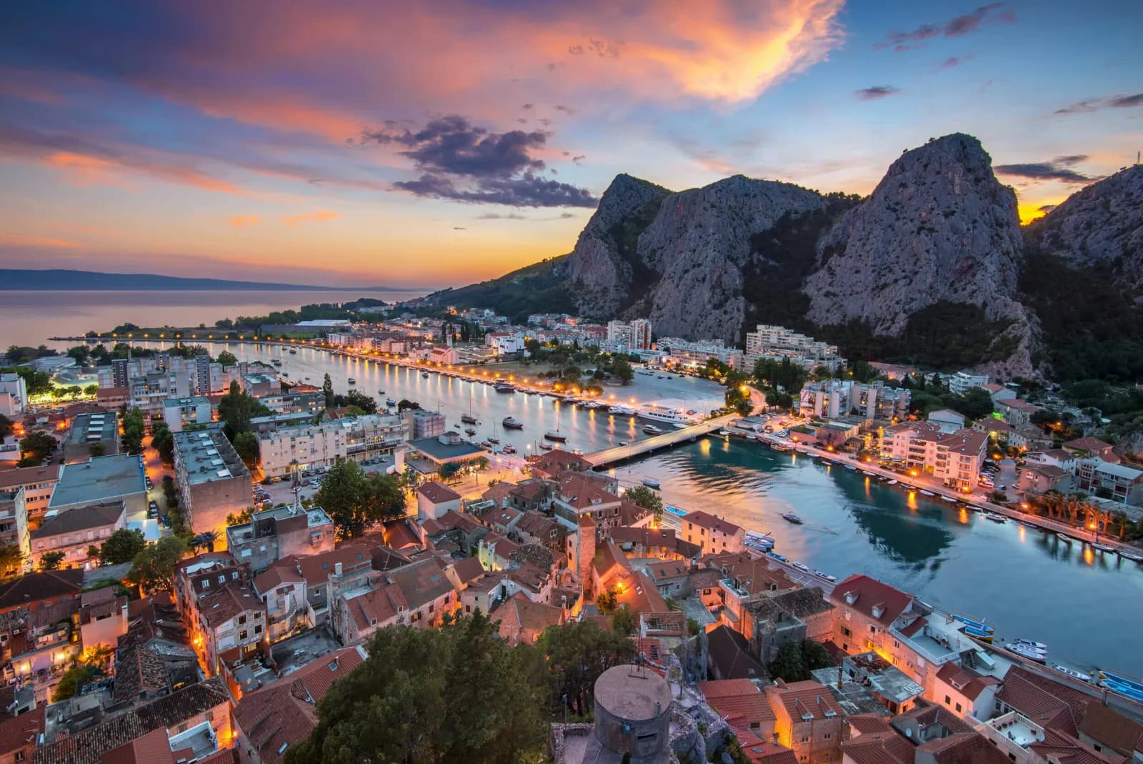 The town of Omiš beneath dramatic cliffs where the Cetina River meets the Adriatic, Croatia